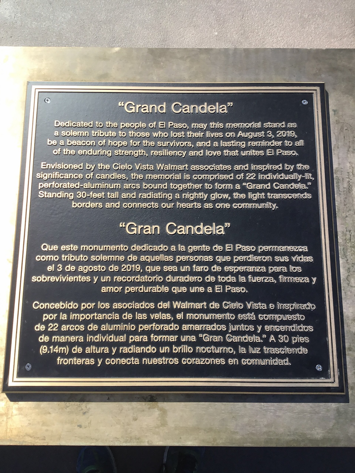 Bilingual English and Spanish dedication plaque at the Grand Candela memorial in El Paso