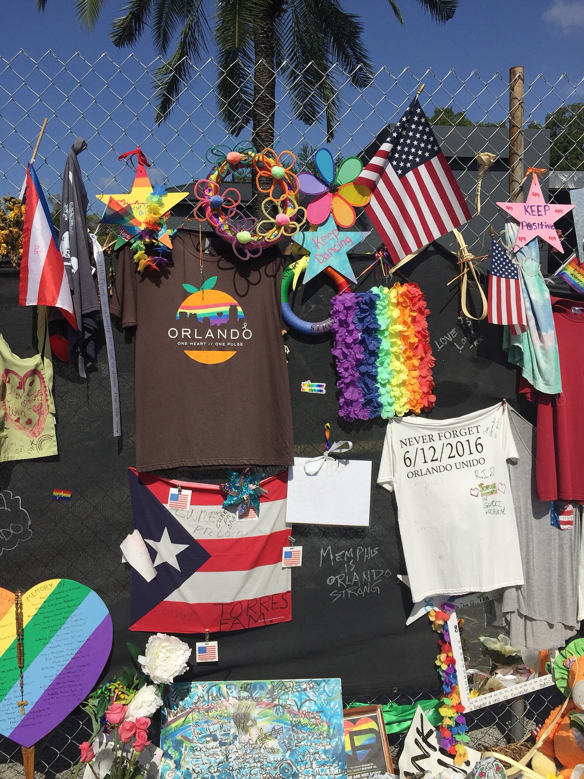 Rainbow tributes, flags, messages, and remembrance items at the Pulse street memorial in Orlando in August 2016