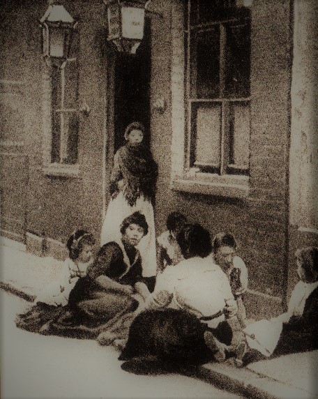Women and children outside a Whitechapel common lodging house near two murder locations, circa 1890