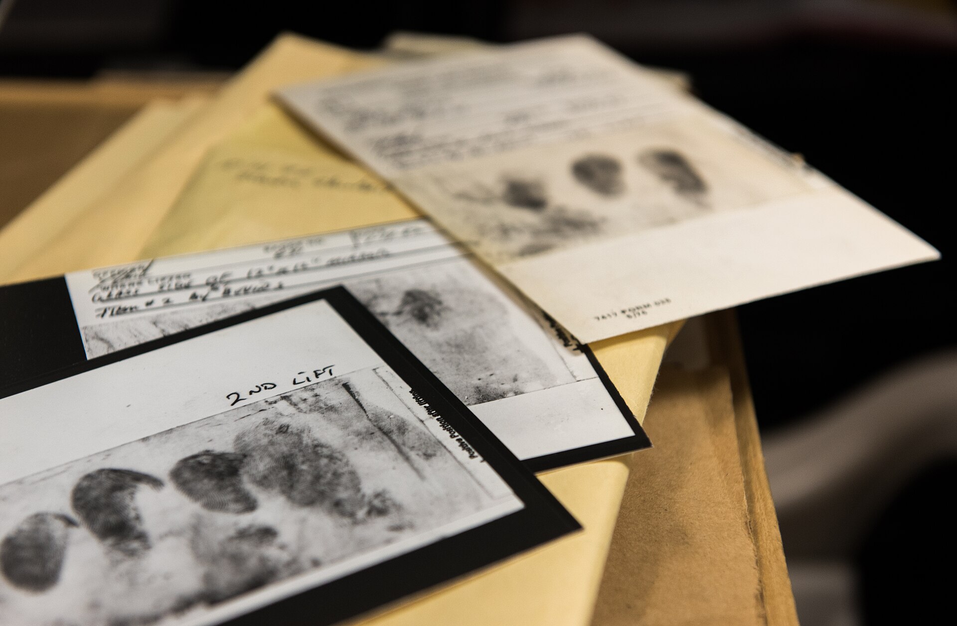 FBI evidence photograph showing latent fingerprints, shoe-tread impressions, and other cold-case materials from the East Area Rapist investigation