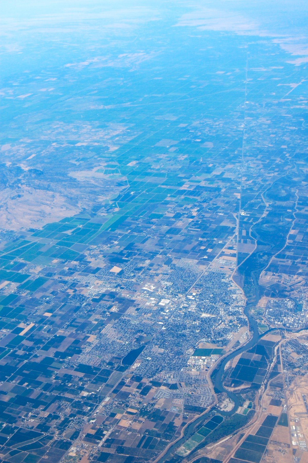 Aerial view of Yuba City, the surrounding Sutter County farmland, and the Feather River, where authorities found the victims in nearby orchards in 1971
